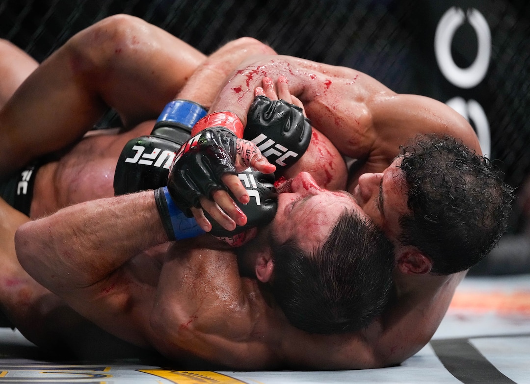 (Francisco Kjolseth | The Salt Lake Tribune) No. 6 ranked middleweight Paulo Costa of Brazil, right, has a bloody round with former middleweight champion Luke Rockhold of the United States during their UFC 278 mixed martial arts bout in the octagon at Vivint Arena in Salt Lake City on Saturday, Aug. 20, 2022. 