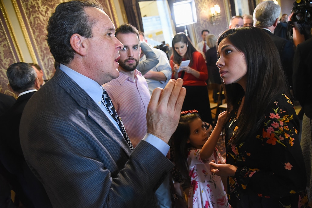 (Francisco Kjolseth | The Salt Lake Tribune) Rep. Brad Daw, R-Orem, speaks with Enedina Stanger, who left Utah for Colorado three-years ago to seek medical marijuana treatment for her severe chronic pain from Ehlers-Danlos Syndrome. Supporters and opponents of UtahÕs medical marijuana initiative joined with Utah Gov. Gary Herbert and legislative leaders Thursday, Oct. 4, 2018, at the Utah Capitol to announce a Òshared visionÓ for cannabis policy.
