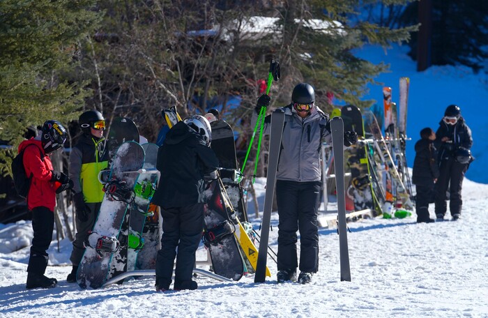 (Bethany Baker | The Salt Lake Tribune) Skiers and snowboarders adjust their gear at Sundance Resort near Provo on Thursday, Dec. 14, 2023.