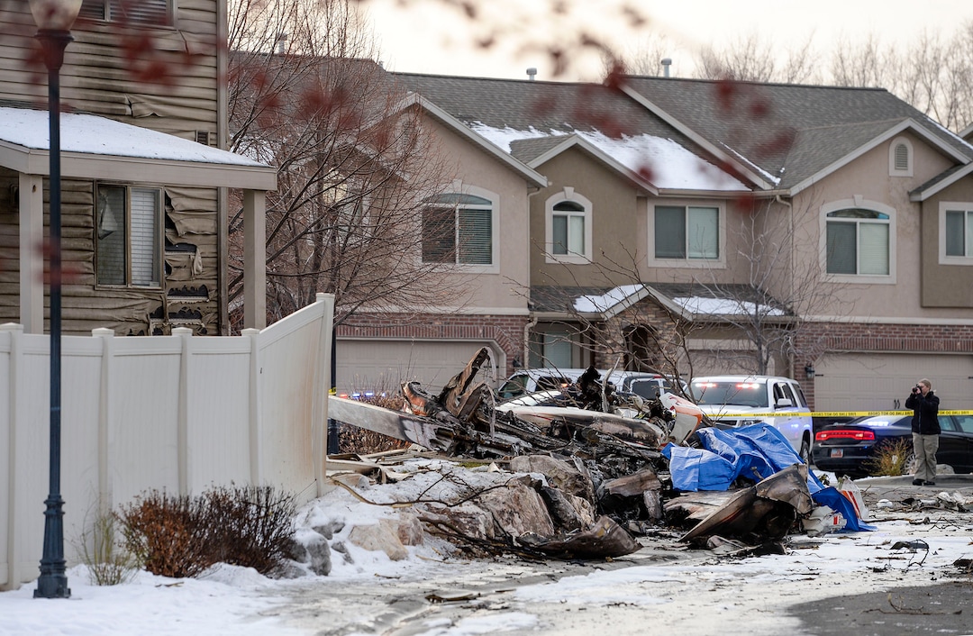 (Leah Hogsten  |  The Salt Lake Tribune) Weber County emergency personnel and firefighters work the scene of a small, private plane that crashed in a residential neighborhood in Roy, Jan. 15, 2020.  A 64-year-old pilot was killed.