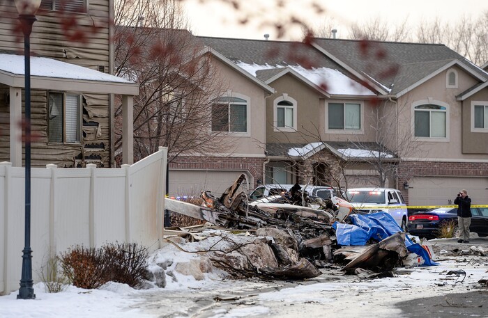 (Leah Hogsten | The Salt Lake Tribune) Weber County emergency personnel and firefighters work the scene of a small, private plane that crashed in a residential neighborhood in Roy, Jan. 15, 2020. A 64-year-old pilot was killed.