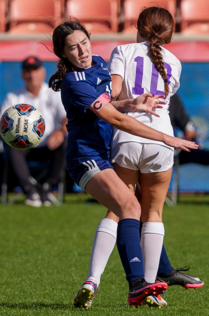 (Leah Hogsten | The Salt Lake Tribune) Skyline's Rozlin Gomez (12) collides with Lehi's Erin Dahl (10) during the 5A State Soccer Championship game on Friday. Skyline High School defeated Lehi High School, 3-1 to win the 5A Championship title Oct. 22, 2021 at Rio Tinto Stadium.