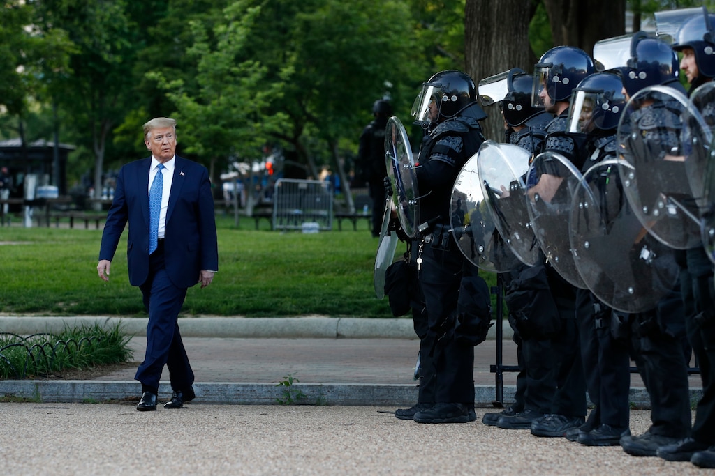 (Patrick Semansky | AP photo)
President Donald Trump walks past police in Lafayette Park after visiting outside St. John's Church across from the White House Monday, June 1, 2020, in Washington. Part of the church was set on fire during protests on Sunday night.