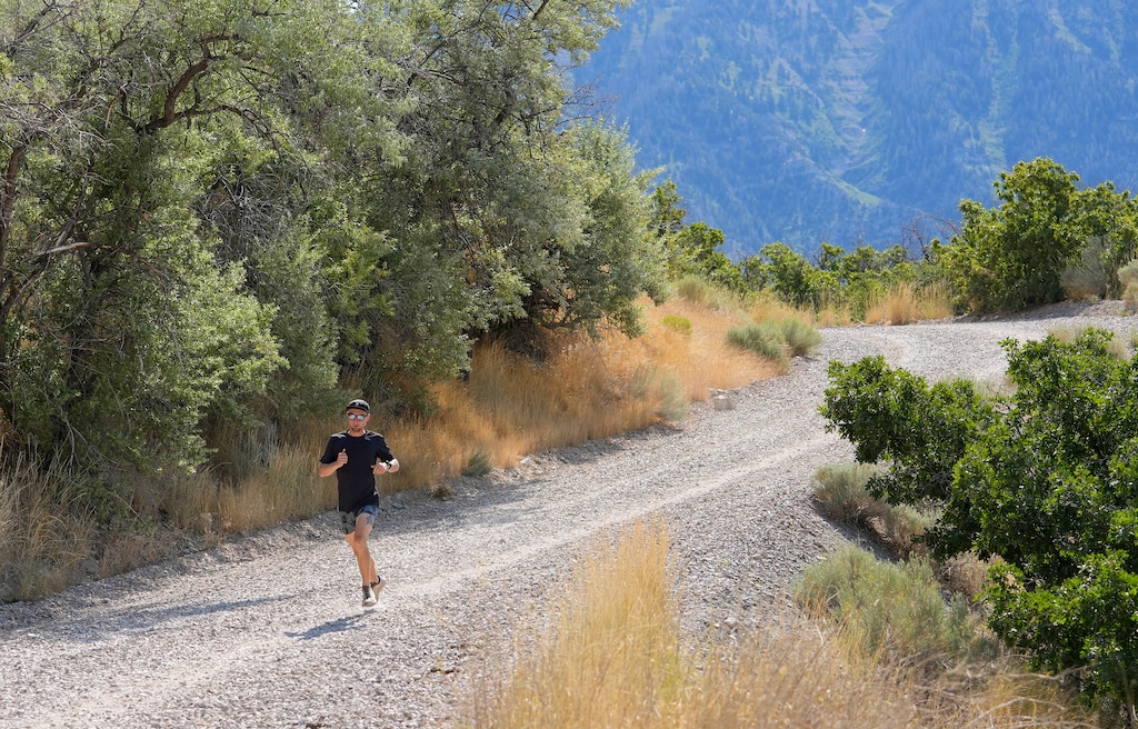 (Chris Samuels | The Salt Lake Tribune) Kyle Burgess runs on the Bonneville Shoreline Trail in Orem, Friday, July 25, 2025. Utah lawmakers are seeking two different paths to changing a new law that requires a hunting or fishing licenses for any access to the Wildlife Management Areas in the four most populous Utah counties: Salt Lake, Utah, Davis and Weber. The Timpanogos WMA, which includes this section of trail, was granted an easement in July.