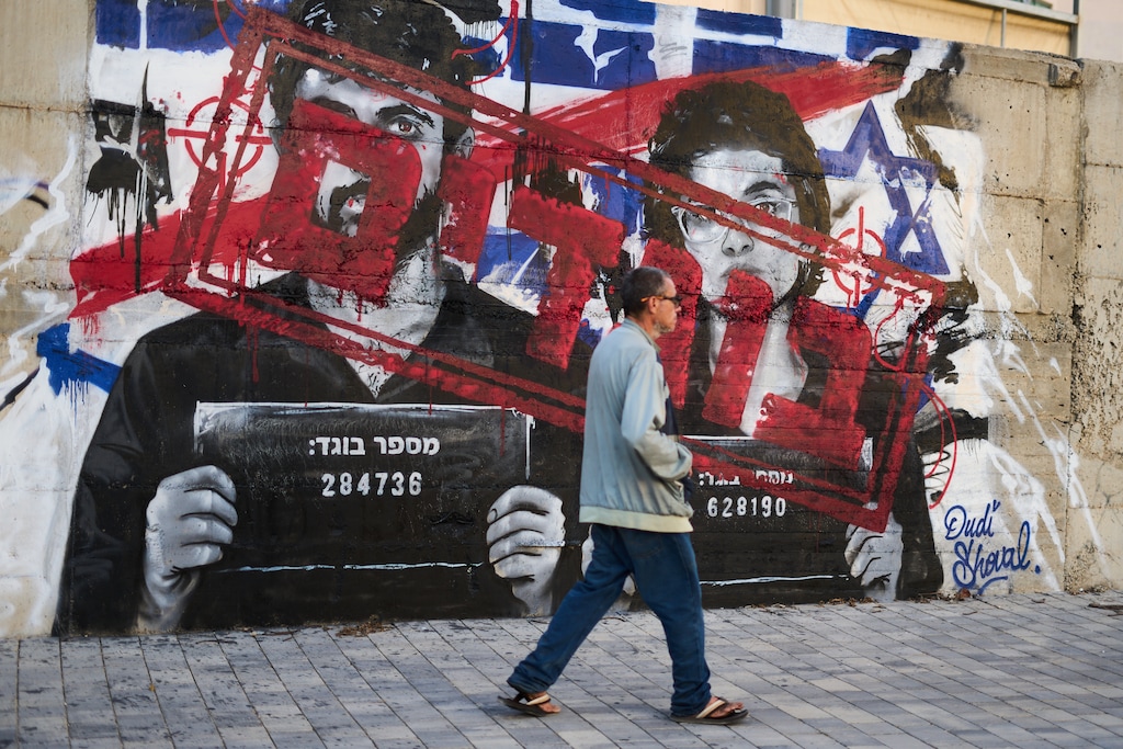 Graffiti showing directors Rachel Szor and Yuval Abraham, winners of the special jury prize for the film 'Naza', with the Hebrew writings "traitors" in Ashdod, Israel, Tuesday, Sept. 15, 2026. (AP Photo/Ariel Schalit)