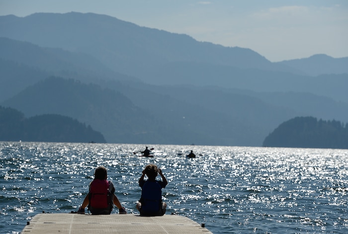 (Francisco Kjolseth  |  The Salt Lake Tribune)  Sarina Wechsler, 8, and her brother Gavin, 6, of Huntington Beach, CA, use special glasses to take in the transition of the total solar eclipse from a floating dock at Palisades Reservoir, Idaho, on Monday, August 21, 2017.