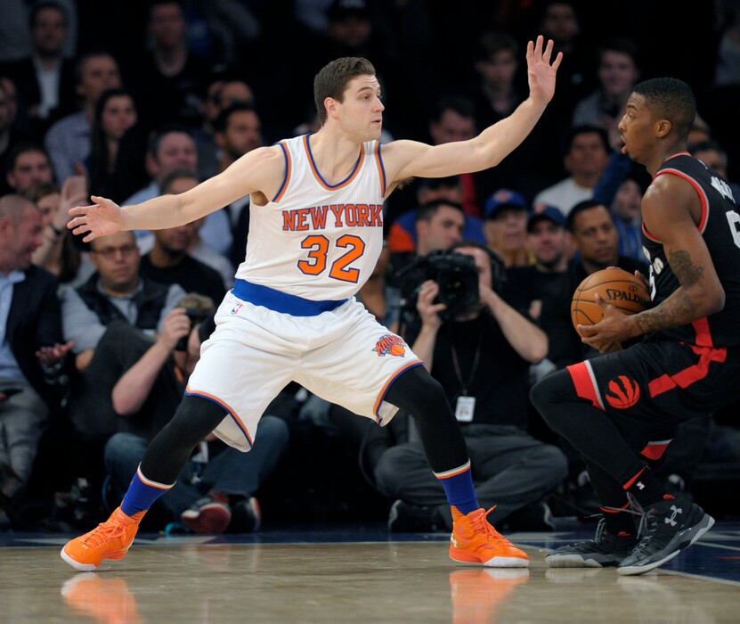 New York Knicks guard Jimmer Fredette (32) guards Toronto Raptors' Deion Wright during the fourth quarter of an NBA basketball game against the Toronto Raptors Monday, Feb. 22, 2016, at Madison Square Garden in New York. The Raptors won 122-95. (AP Photo/Bill Kostroun)