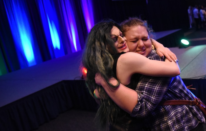 (Francisco Kjolseth  |  The Salt Lake Tribune)  Bryson LaBar, left, a.k.a. Madame LaCrude, gets a big hug from Larissa Washburn following his drag queen performance at Utah State University. 