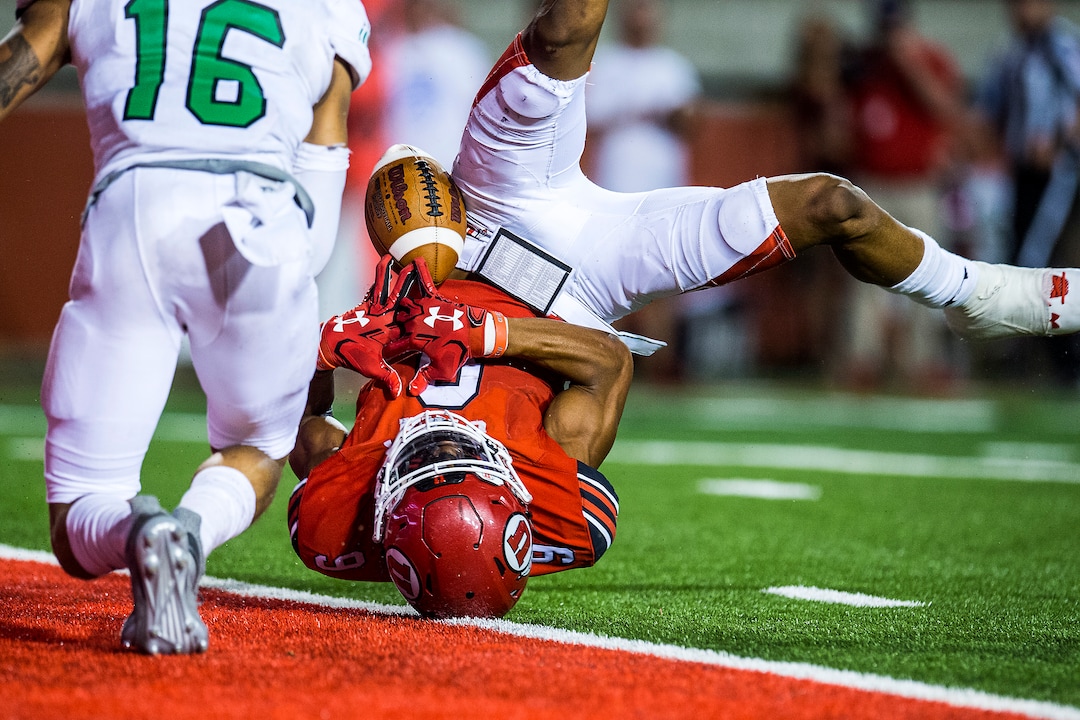 (Chris Detrick  |  The Salt Lake Tribune)  Utah Utes wide receiver Darren Carrington (9) comes up short of a touchdown while being guarded by North Dakota Fighting Hawks defensive back Torrey Hunt (16) during the game at Rice-Eccles Stadium Thursday, August 31, 2017. Utah Utes defeated North Dakota Fighting Hawks 37-16.