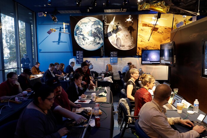 (Marcio Jose Sanchez | The Associated Press) Journalists gather at NASA's Jet Propulsion Laboratory awaiting the landing of InSight on Mars Monday, Nov. 26, 2018, in Pasadena, Calif . A NASA spacecraft is just a few hours away from landing on Mars. The InSight lander is aiming for a Monday afternoon touchdown on what scientists and engineers hope will be a flat plain on the red planet.