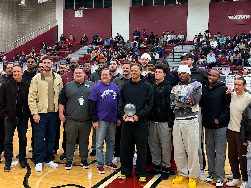 Jazz guard Keyonte George with his former high school basketball coach David Watson, Lewisville mayor TJ Gilmore, and George's Utah Jazz teammates, coaches, and staff at Lewisville High School in Texas. (Andy Larsen | The Salt Lake Tribune)