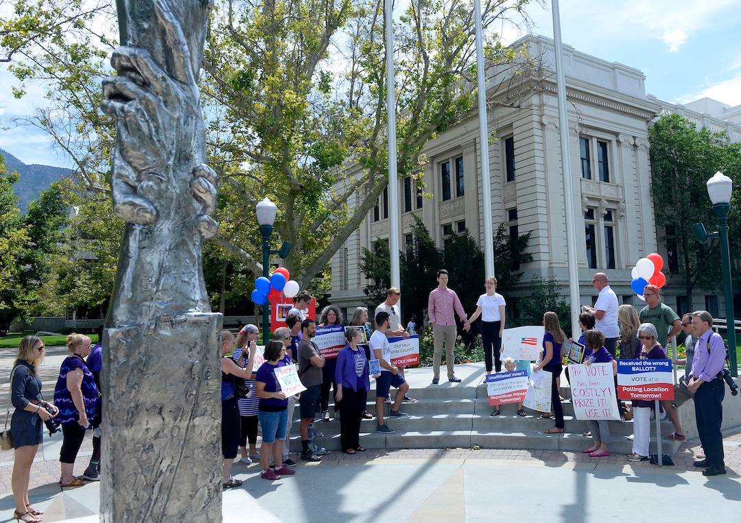 (Al Hartmann  |  The Salt Lake Tribune) Mormon Women for Ethical Government, Salt Lake Indivisible and Action Utah members rally against the confusing process of special election to fill Chaffetz' 3rd District seat outside the historical courthouse in Provo Monday Aug 14. 