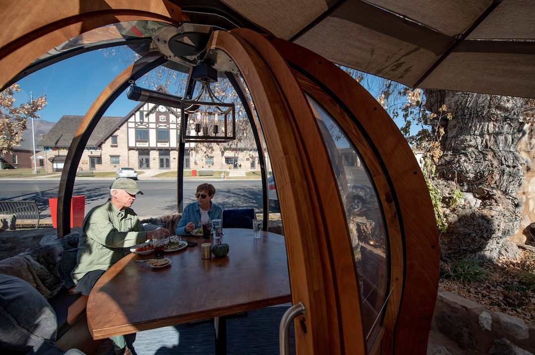 (Francisco Kjolseth  |  The Salt Lake Tribune) John and Suzi Nielsen try out one of three dome-like Alpenglobes at Cafe Galleria in Midway on Thursday, Nov. 5, 2020.