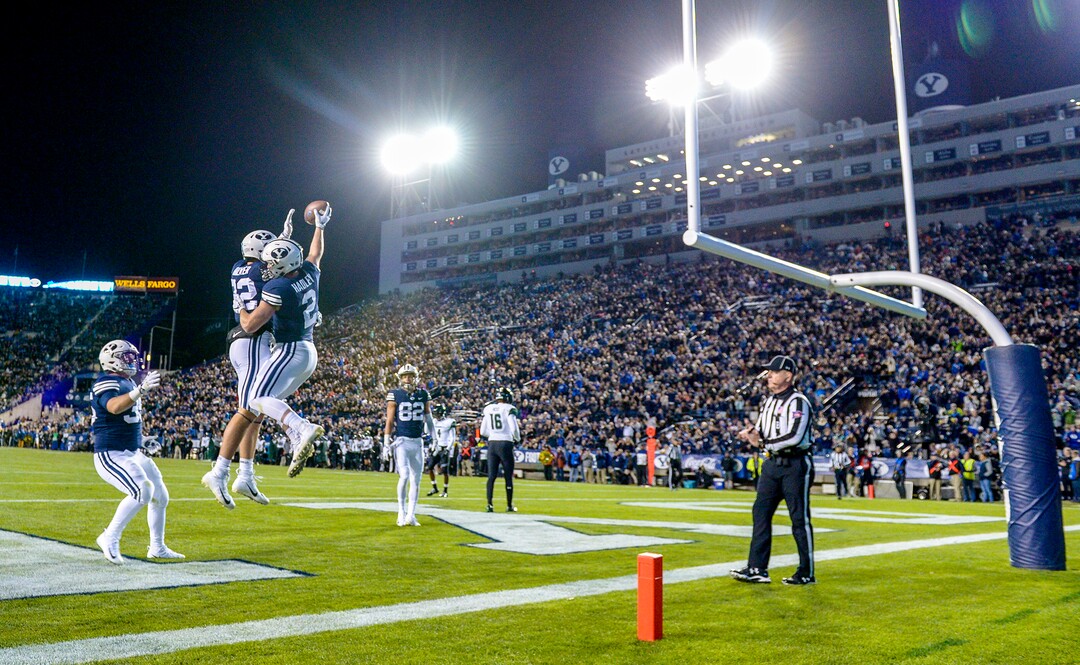 Leah Hogsten  |  The Salt Lake Tribune Brigham Young Cougars running back Matt Hadley (2) celebrates his touchdown with Brigham Young Cougars defensive back Chris Wilcox (32) as Brigham Young University hosts Hawaii at Lavell Edwards Stadium in Provo, Saturday Oct. 13, 2018. 