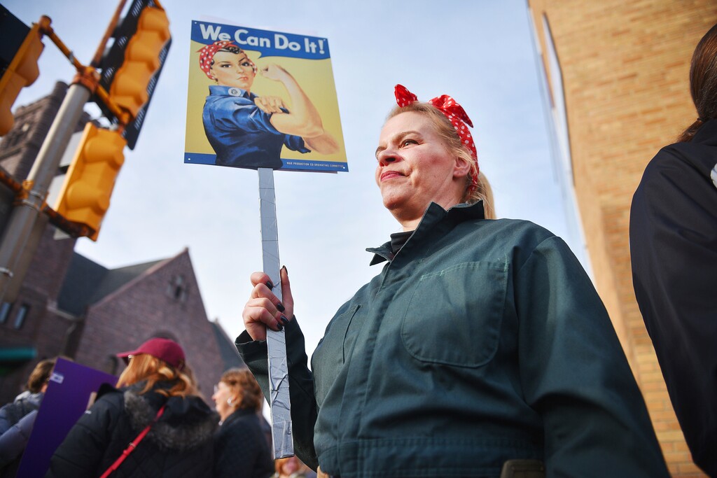 (Briana Sanchez | The Argus Leader via AP file photo)  Sheila Dathe wears a "Rosie the Riveter" inspired work uniform to the Women's March Saturday, Jan. 20, 2018 in downtown Sioux Falls, S.D. The march is among dozens of rallies being held around the country. The activists are hoping to create an enduring political movement that will elect more women to government office.
