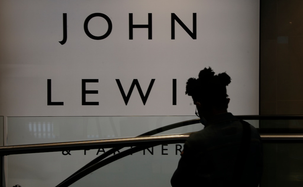 A woman walks by a branch of John Lewis, in London, Thursday, July 16, 2020.Unemployment across the U.K. has held steady during the coronavirus lockdown as a result of a government salary support scheme, but there are clear signals emerging that job losses will skyrocket over coming months. The Office for National Statistics said Thursday there were 649,000 fewer people, or 2.2%, on payroll in June when compared with March when the lockdown restrictions were imposed. (AP Photo/Alastair Grant)
