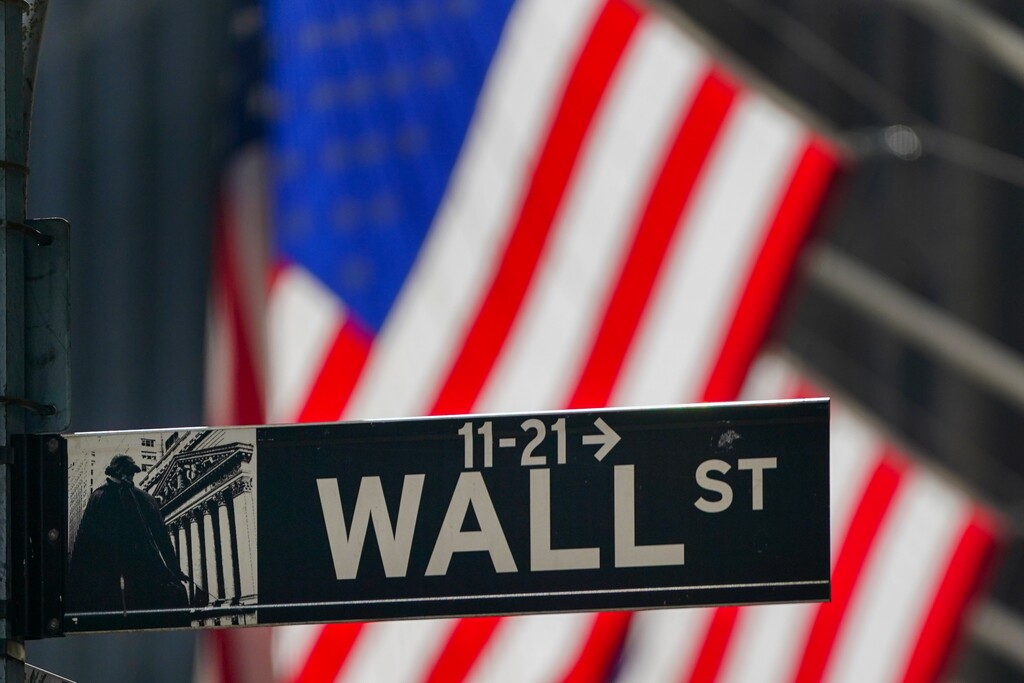 (Frank Franklin II | AP file photo) The American flag hangs outside the New York Stock Exchange in New York on Oct. 14, 2020.