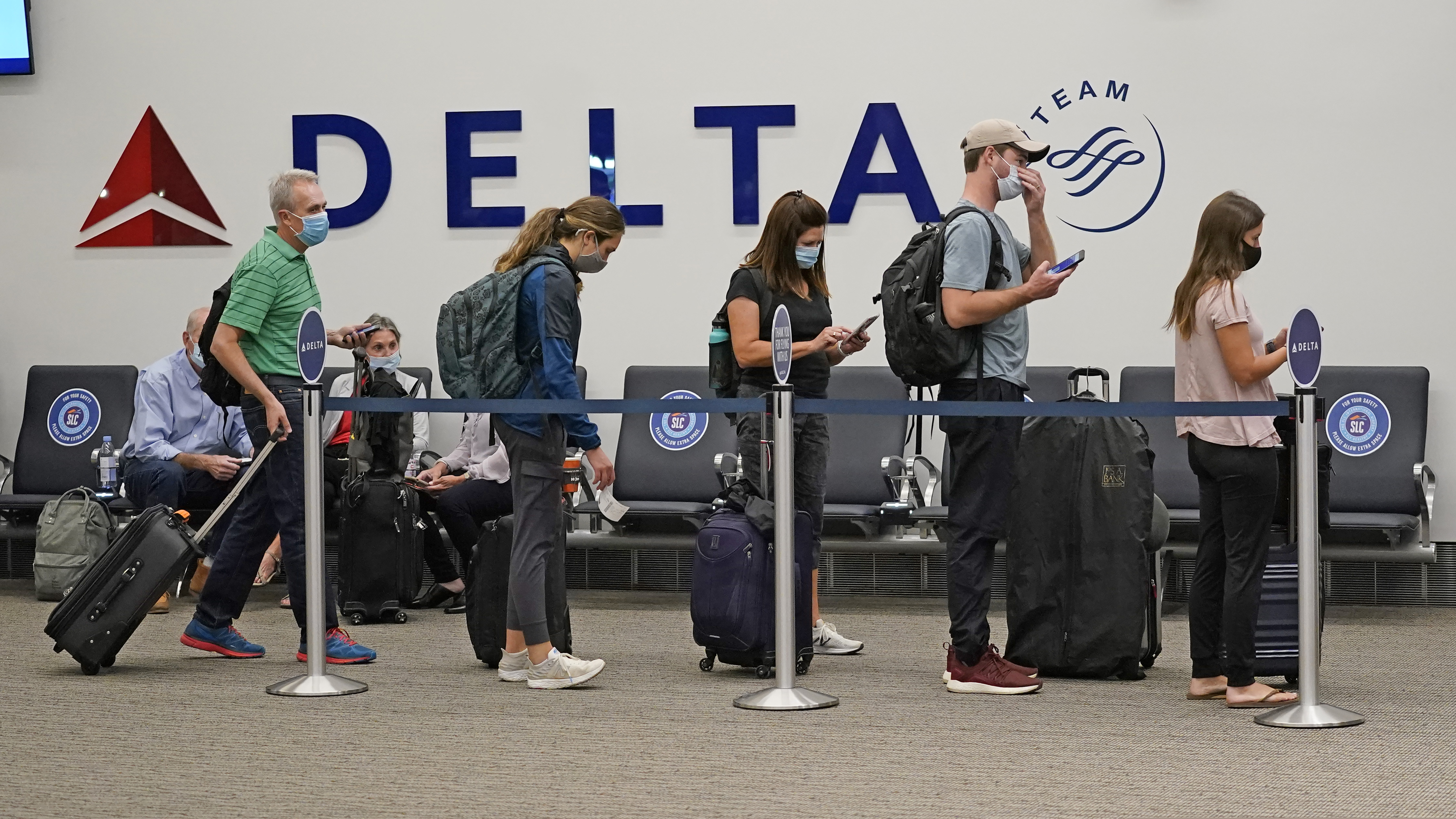 (Rick Bowmer | AP file photo) Delta passengers wait to board their flight in the new terminal at the Salt Lake City International Airport on Sept. 15, 2020. Sen. Mike Lee opposes a new stand-alone relief bill for airlines.