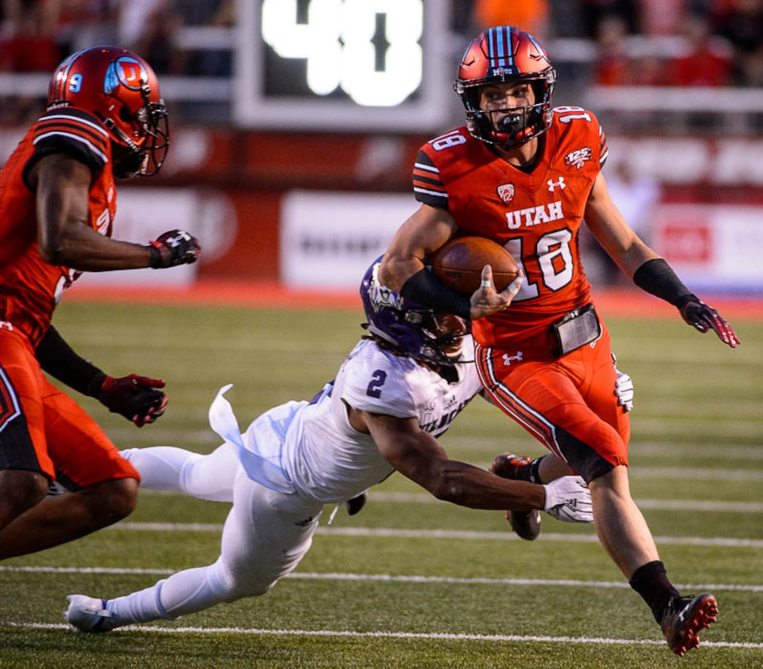 (Trent Nelson | The Salt Lake Tribune)  Utah Utes wide receiver Britain Covey (18) makes a long, crazy run as the University of Utah Utes host the Weber State Wildcats, Thursday Aug. 30, 2018 at Rice-Eccles Stadium in Salt Lake City.