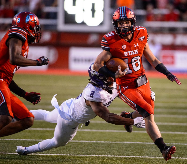 (Trent Nelson | The Salt Lake Tribune)  Utah Utes wide receiver Britain Covey (18) makes a long, crazy run as the University of Utah Utes host the Weber State Wildcats, Thursday Aug. 30, 2018 at Rice-Eccles Stadium in Salt Lake City.