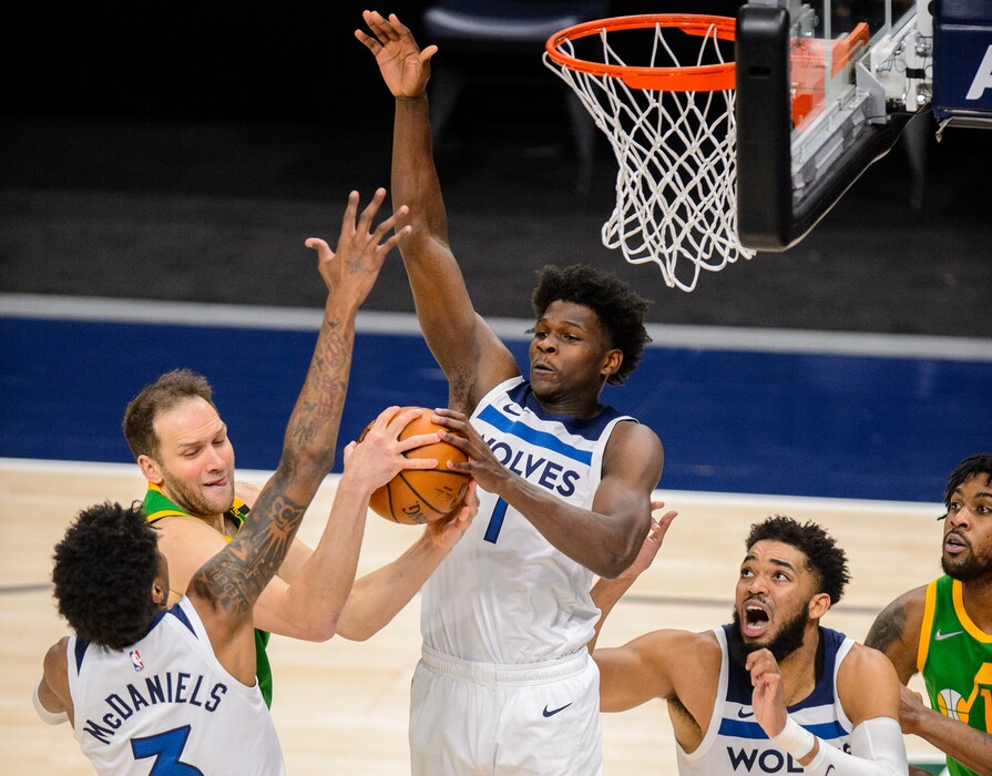 (Trent Nelson | The Salt Lake Tribune) Utah Jazz forward Bojan Bogdanovic (44) defended by Minnesota Timberwolves forward Jaden McDaniels (3), Minnesota Timberwolves forward Anthony Edwards (1), and Minnesota Timberwolves center Karl-Anthony Towns (32) as the Utah Jazz host the Minnesota Timberwolves, NBA basketball in Salt Lake City on Saturday, April 24, 2021.
