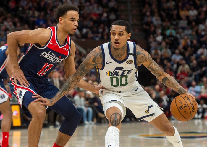 (Rick Egan  |  The Salt Lake Tribune)     Utah Jazz guard Jordan Clarkson (00) dribbles as Washington Wizards guard Jerome Robinson (12) defends, in NBA action between the Utah Jazz and the Washington Wizards, in Salt Lake City, Friday, February 28, 2020