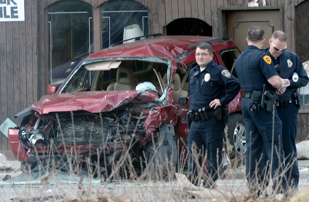 Al Hartmann | The Salt Lake Tribune
Salt Lake Police investigate accident scene at 700 North 300 West Thursday Feb. 16. Two cars were involved with three fatalities. The blue car going northbound along 300 West skidded, jumped the median and struck a southbound SUV.