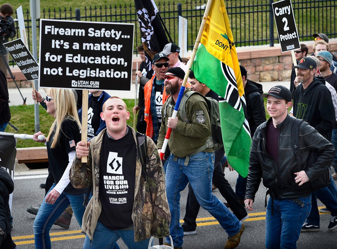 (Scott Sommerdorf | The Salt Lake Tribune) Pro-gun March Before Our lives  marchers shout at members of the media as they march up State Street to the Utah State Capitol building, Saturday, March 24, 2018.