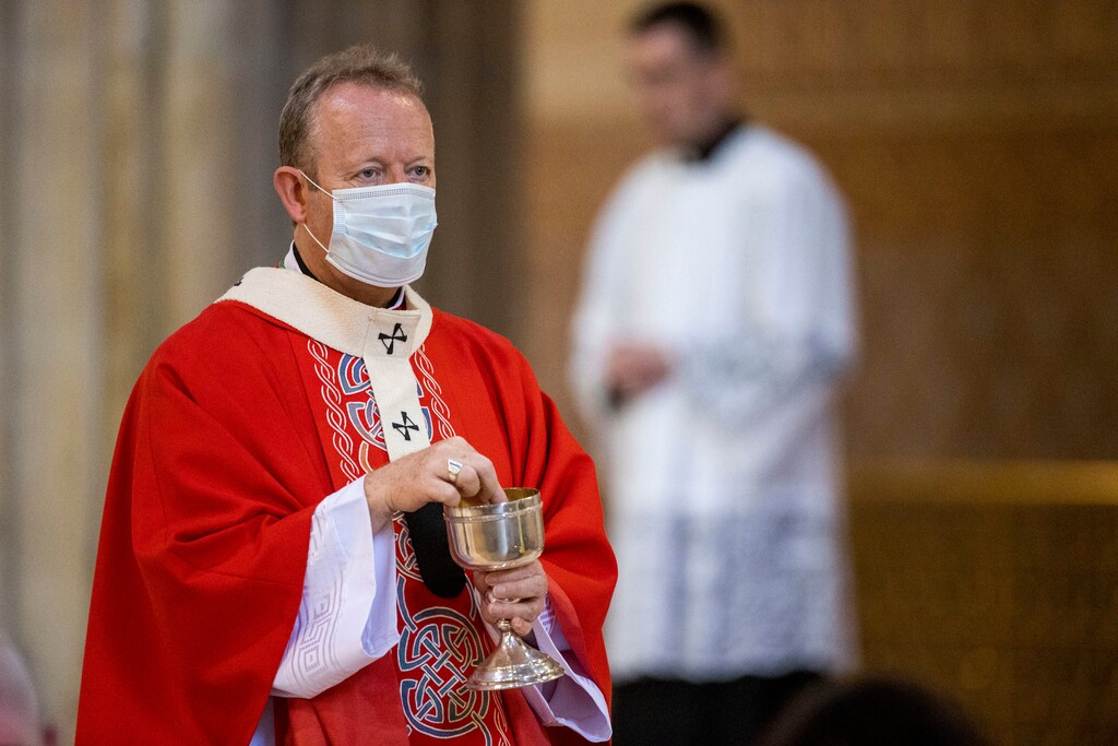 (Liam McBurney | PA via AP file photo) Eamon Martin, Archbishop of Armagh and the Primate of All Ireland, wears a face mask during holy communion, during Mass at St Patrick's Catholic Cathedral for the Feast of Saints Peter and Paul, in Armagh, Northern Ireland, Monday June 29, 2020.