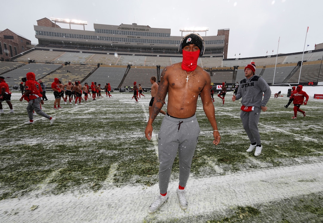 Utah linebacker Chris Hart warms up on the field in a light snow before the first half of an NCAA college football game against Colorado Saturday, Nov. 17, 2018, in Boulder, Colo. (AP Photo/David Zalubowski)