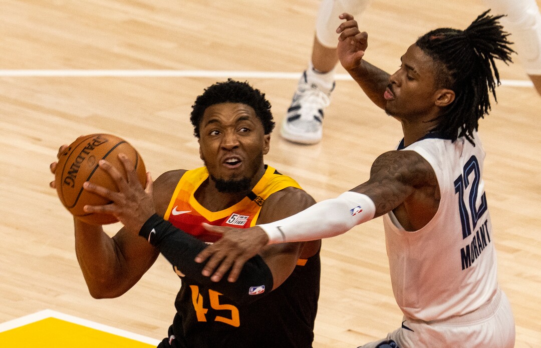 (Rick Egan | The Salt Lake Tribune) Utah Jazz guard Donovan Mitchell (45) gets by Memphis Grizzlies guard Ja Morant (12) to score, in game 2 of NBA Playoffs at Vivint Arena, on Wednesday, May 26, 2021.