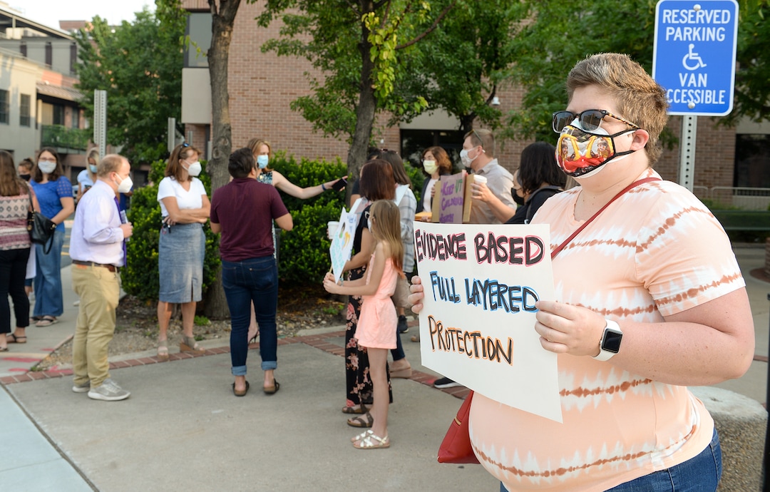 (Chris Samuels | The Salt Lake Tribune) Katie Nelson participates in a rally advocating mask use in schools outside the Utah Board of Education building, Friday, Aug. 6, 2021. Nelson worries that her son, a preschooler with health conditions, may not be protected from contracting coronavirus if masks are not mandated in schools.