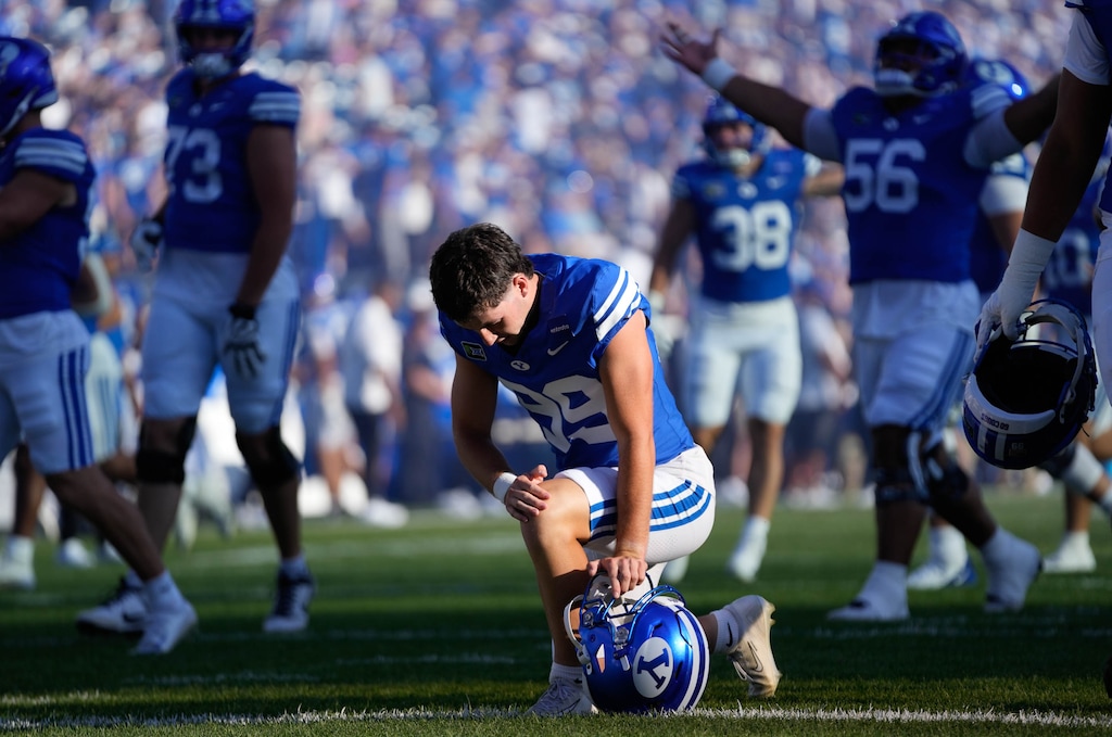 (Francisco Kjolseth | The Salt Lake Tribune) BYU players bow their heads before the start of their game against Utah Tech, Saturday, Sept. 5, 2026, at LaVell Edwards Stadium in Provo.