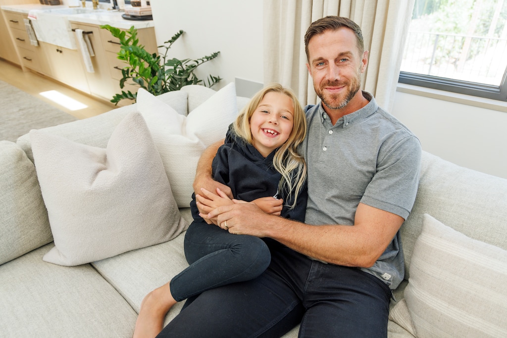 (Rachel Bujalski | The New York Times) Alex Smith with his daughter Sloane, whose goal is to dance competitively, in Woodside, Calif., Aug. 15, 2023. Smith returned to play pro football after a horrific leg injury nearly killed him. Nothing about his recovery prepared him for the helplessness of watching his daughter battle a brain tumor.