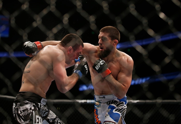 Court McGee, right, and Josh Neer trade punched during their UFC welterweight mixed martial arts match in Anaheim, Calif., Saturday, Feb. 23, 2013. (AP Photo/Jae C. Hong)