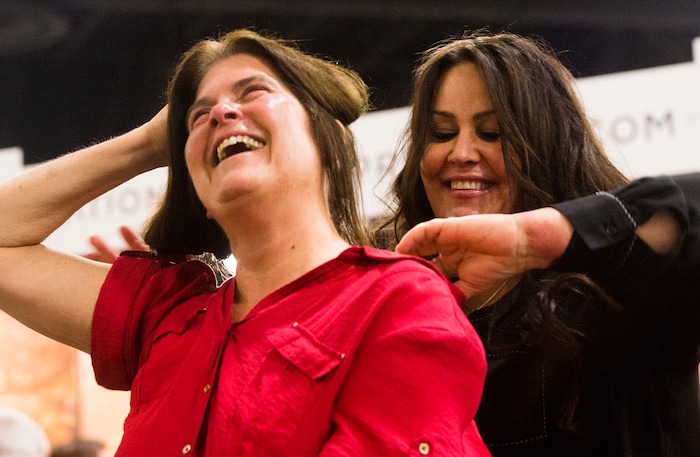 (Rick Egan  |  The Salt Lake Tribune)   Rima Clark with Aspen's Organics, rubs an some organic cream on Debbie Hillyard (left) at the Salt Lake Tribune Home & Garden show, at the Mountain America Expo Center in Sandy, Saturday, March 10, 2018. 