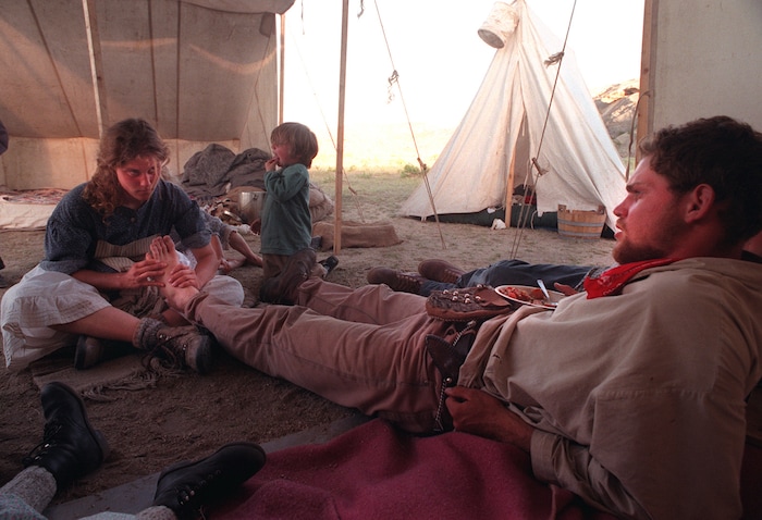 Rick Egan  | Tribune File Photo 

Wendy Westergard, Salt Lake City, gives a foot rub to Heber Dew, Sandy, in camp after a long day of walking.  Dew is pulling a hand cart along the trail.