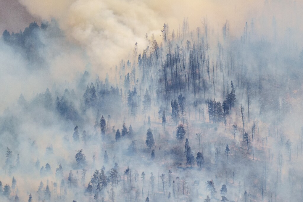 (Trent Nelson  |  The Salt Lake Tribune) Wind blows the smoke away for a moment, revealing the damage from the Parleys Canyon Fire burns on Saturday, Aug. 14, 2021. Most of the smoke plaguing Utah this week is from fires on the West Coast.