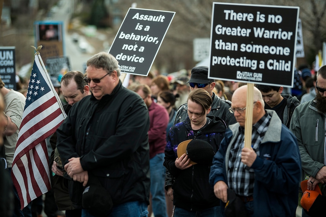 (Chris Detrick | The Salt Lake Tribune)  Participants hold signs during the March Before Our Lives rally near West High School in Salt Lake City Saturday, March 24, 2018.