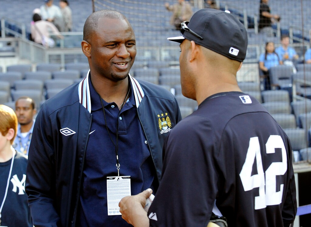 FILE - In this Friday, May 17, 2013 file photo, New York Yankees pitcher Mariano Rivera, right, chats with Patrick Vieira during batting practice, at Yankee Stadium in New York. Arsenal is looking for a new manager for the first time this century after Arsene Wenger on Friday, April 20, 2018 announced his decision to leave his role at the end of this season. The favorite with British bookmakers, the 41-year-old Vieira was one of Wenger's first signings and went on to become one of Arsenal’s greatest ever players in a nine-year spell. (AP Photo/Bill Kostroun, file)