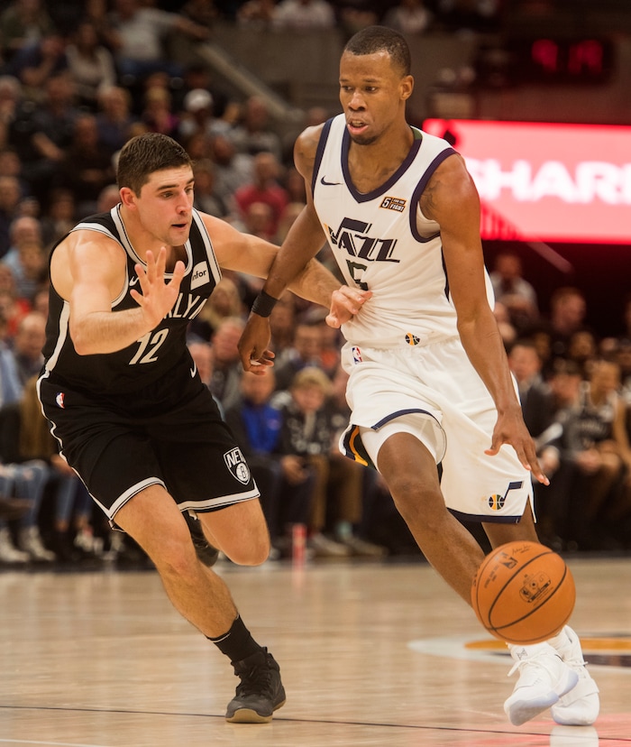 (Rick Egan  |  The Salt Lake Tribune)  Brooklyn Nets guard Joe Harris (12) defends, as Utah Jazz guard Rodney Hood (5) takes the ball down court, in NBA action, Utah Jazz vs. Brooklyn Nets, in Salt Lake City, Saturday, November 11, 2017.
