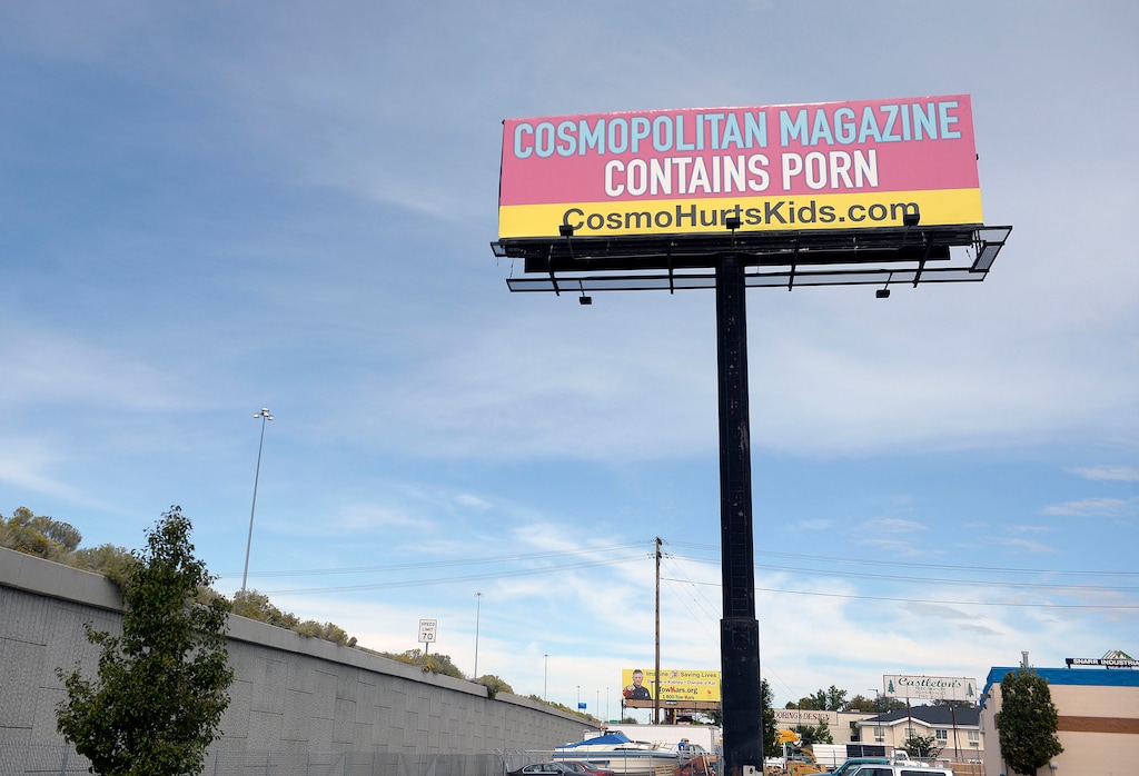 (Al Hartmann | The Salt Lake Tribune)
Brightly colored billboard just north of the 5300 S. exit on I-15 northbound claims that Cosmopolitan magazine is pornographic. That ad campaign is central to a move that may revive the long-dormant state office that was popularly called the porn czar.