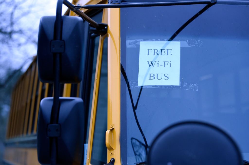 (Meg Kinnard | AP) A Wi-Fi-enabled school bus is seen at an apartment complex in Winnsboro, S.C., where such buses were sent to rural and low-income areas during the COVID-19 pandemic to help distance-learning students access the internet. In Utah, Gov. Spencer Cox vetoed a plan to offer Wi-Fi access on rural school buses.