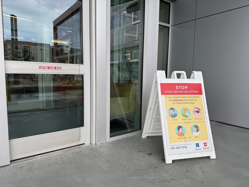 (Rachel Crosby | The Salt Lake Tribune) A sign at the Sugar House Health Center in Salt Lake City describes measles symptoms on Monday, March 2, 2026. Measles cases in Utah have risen to 559 since the outbreak began in June 2025.