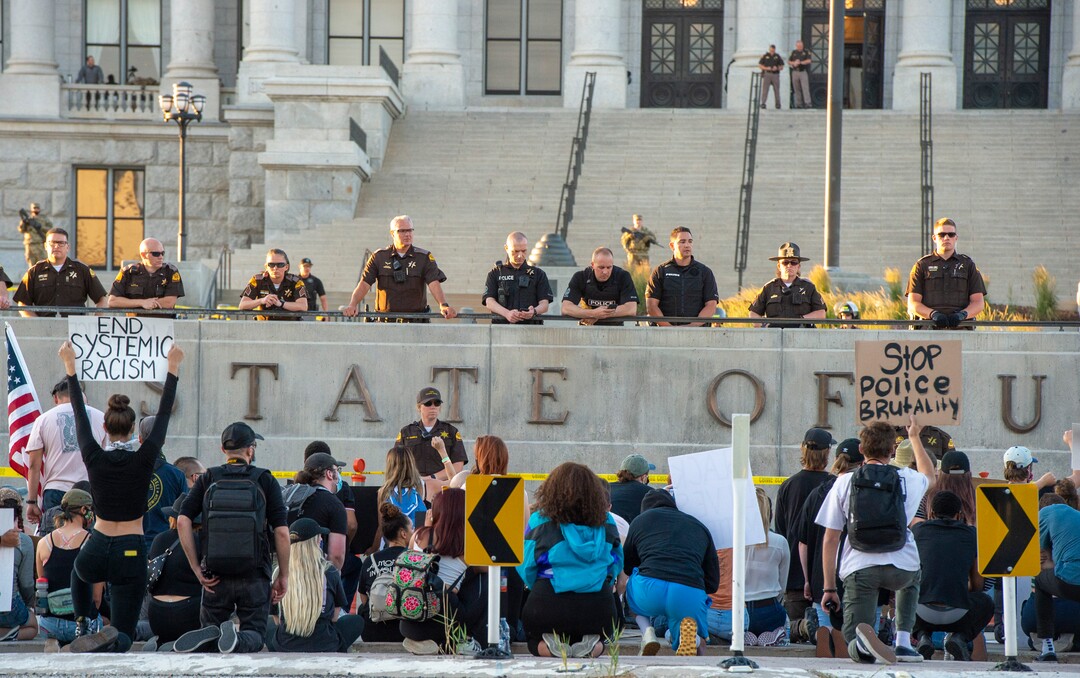 (Rick Egan  |  The Salt Lake Tribune) Protesters kneel down in silence for 9 minutes in remembrance of George Floyd as they gather at the State Capitol for a demonstration, Wednesday, June 3, 2020.