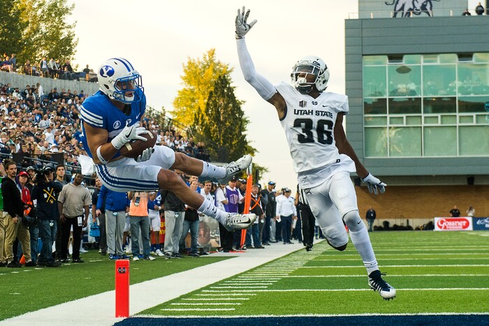 (Chris Detrick  |  The Salt Lake Tribune)  Brigham Young Cougars wide receiver Beau Tanner (33) makes a touchdown catch past Utah State Aggies cornerback Ja'Marcus Ingram (36) during the game at Merlin Olsen Field at Maverik Stadium Friday, September 29, 2017.