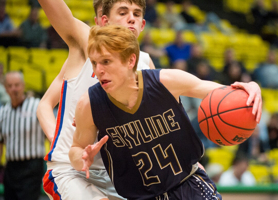(Rick Egan  |  The Salt Lake Tribune)   Skyline Eagles Andrew Clark (24) takes the ball to the hoop, as Timpview Thunderbirds Kelson Jensen (12) defends, in the final seconds of the game, in 5A basketball playoff action between the Timpview Thunderbirds and at the Skyline Eagles, at the UCCU Center in Orem, Monday, Feb. 26, 2018.