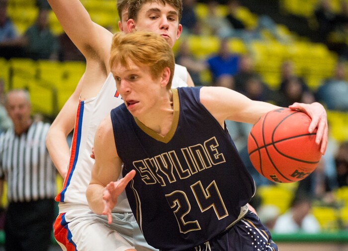 (Rick Egan | The Salt Lake Tribune) Skyline Eagles Andrew Clark (24) takes the ball to the hoop, as Timpview Thunderbirds Kelson Jensen (12) defends, in the final seconds of the game, in 5A basketball playoff action between the Timpview Thunderbirds and at the Skyline Eagles, at the UCCU Center in Orem, Monday, Feb. 26, 2018.