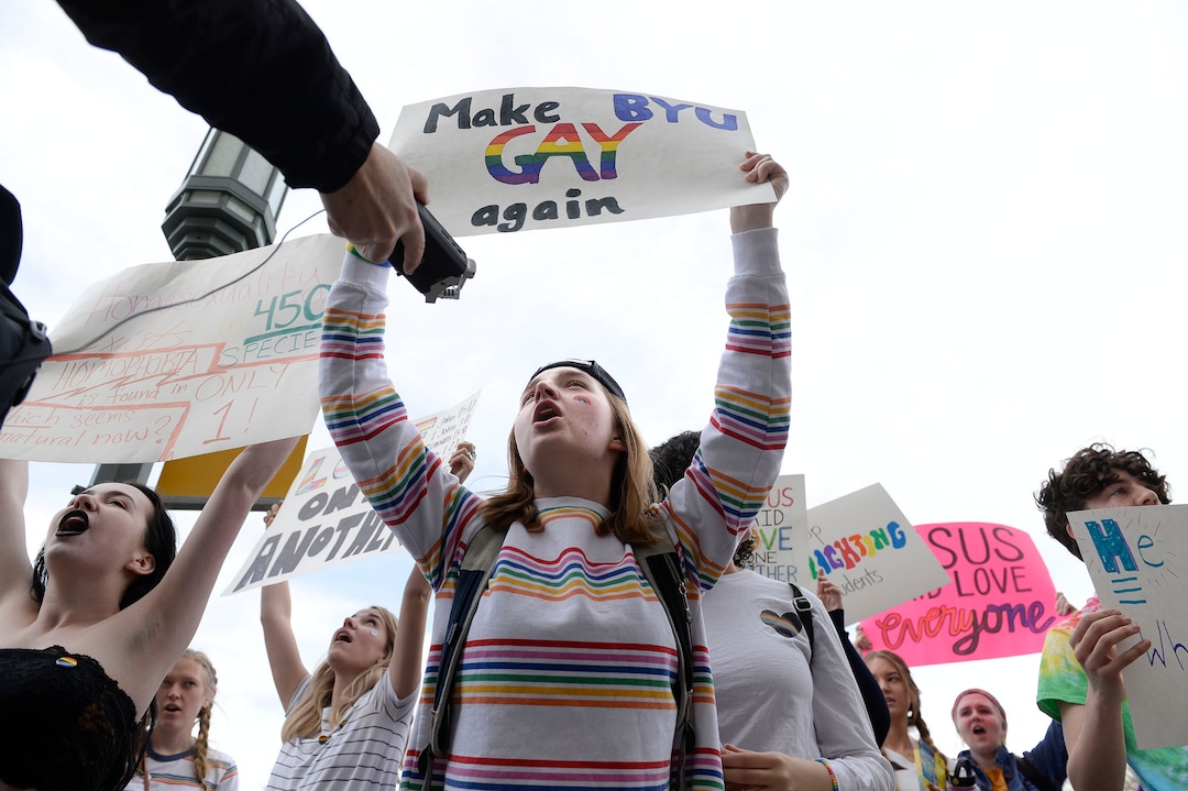 (Leah Hogsten  |  The Salt Lake Tribune) BYU LGBTQ student Kate Lunnen rallies with hundreds of other students and supporters Friday. Brigham Young University LGBTQ students took their concerns about the schoolÕs policy reversal regarding romantic behavior by same-sex couples to The Church of Jesus Christ of Latter-day Saints office building, Mar. 6, 2020. Despite removing the section on Òhomosexual behaviorÓ from BYU Honor Code last month, The LDS Church has clarified for the first time that same-sex romantic behavior is still Ònot compatibleÓ with the rules at BYU.