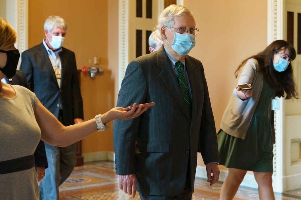 (Jacquelyn Martin | AP) Senate Majority Leader Mitch McConnell of Ky., center, walks to his office from the Senate floor, Tuesday, Sept. 8, 2020, on Capitol Hill in Washington.